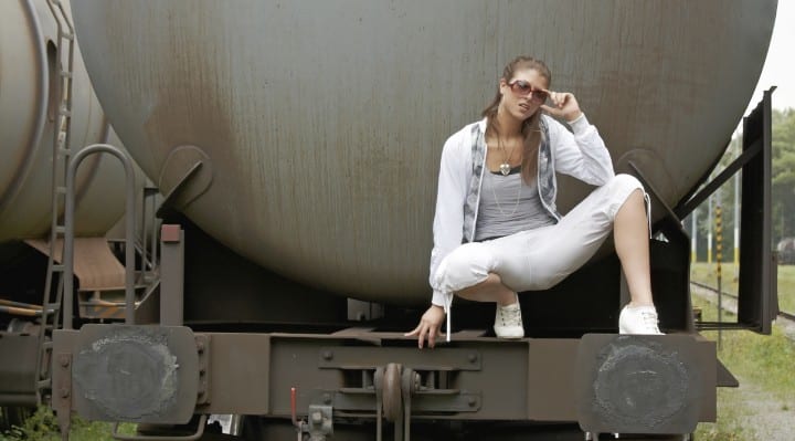 beautiful woman on oil storage tank