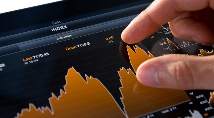Analyzing stock market graph on a touch screen device.