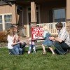 Family in front of new home
