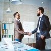 Successful businessmen handshaking after negotiation